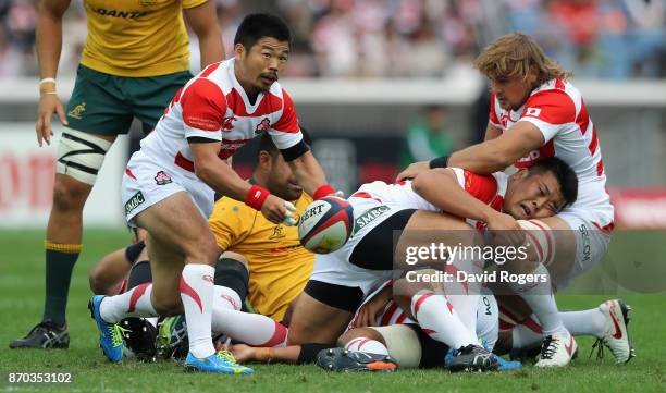 Fumiaki Tanaka of Japan passes the ball during the rugby union international match between Japan and Australia Wallabies at Nissan Stadium on...