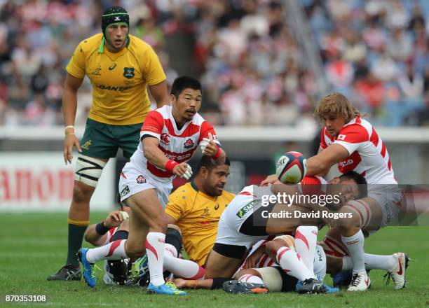 Fumiaki Tanaka of Japan passes the ball during the rugby union international match between Japan and Australia Wallabies at Nissan Stadium on...