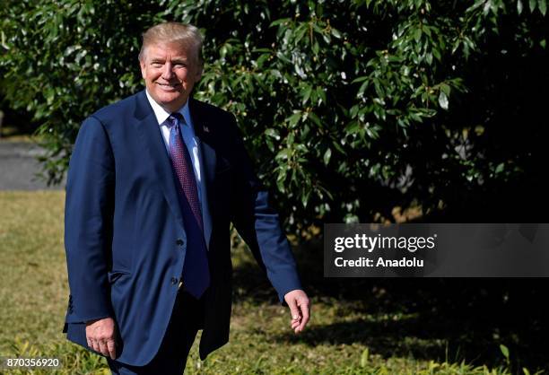 President Donald Trump walks on his way to meet Japanese Prime Minister Shinzo Abe upon his arrival at the Kasumigaseki Country Club in Kawagoe, near...