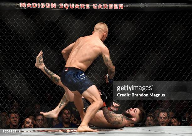 Dillashaw knocks down Cody Garbrandt in their UFC bantamweight championship bout during the UFC 217 event inside Madison Square Garden on November 4,...