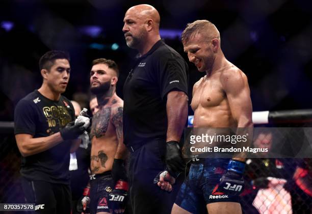 Dillashaw celebrates his knockout victory over Cody Garbrandt in their UFC bantamweight championship bout during the UFC 217 event inside Madison...
