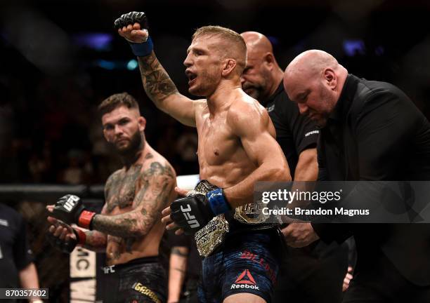 Dillashaw celebrates his knockout victory over Cody Garbrandt in their UFC bantamweight championship bout during the UFC 217 event inside Madison...