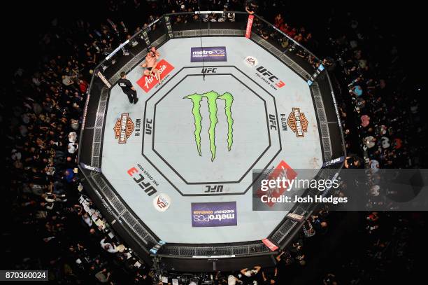 Georges St-Pierre of Canada brings down Michael Bisping of England in their UFC middleweight championship bout during the UFC 217 event at Madison...