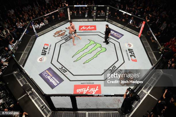Georges St-Pierre of Canada fights Michael Bisping of England in their UFC middleweight championship bout during the UFC 217 event at Madison Square...