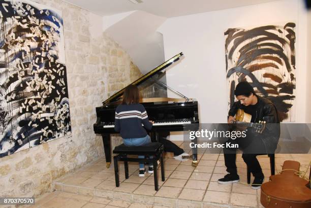 Julie Cormier at piano and Jonathan Velasquez performs on the guitar during the Concert at Galerie Rue Hus as part of Larry Clark : Photos Paintings...
