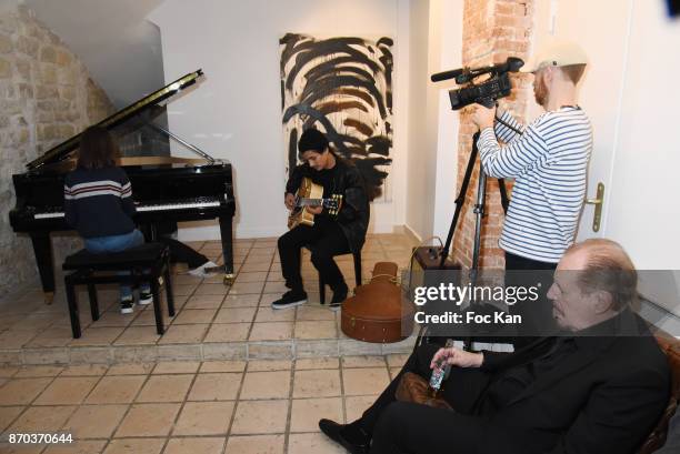 Julie Cormier at piano and Jonathan Velasquez at guitar Larry Clark as spectator during the Concert at Galerie Rue Hus as part of Larry Clark :...