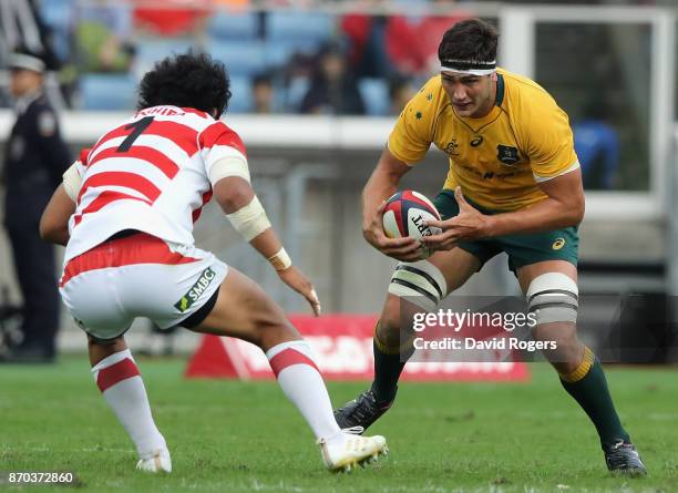 Rob Simmons of Australia takes on Keita Inagaki during the rugby union international match between Japan and Australia Wallabies at Nissan Stadium on...