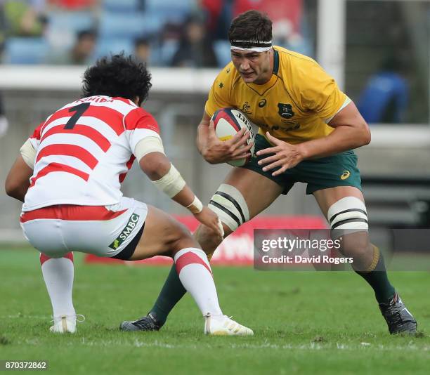 Rob Simmons of Australia takes on Keita Inagaki during the rugby union international match between Japan and Australia Wallabies at Nissan Stadium on...
