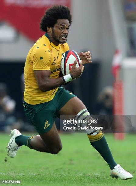 Henry Speight of Australia runs with the ball during the rugby union international match between Japan and Australia Wallabies at Nissan Stadium on...