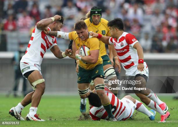 Sean McMahon of Australia is tackled during the rugby union international match between Japan and Australia Wallabies at Nissan Stadium on November...