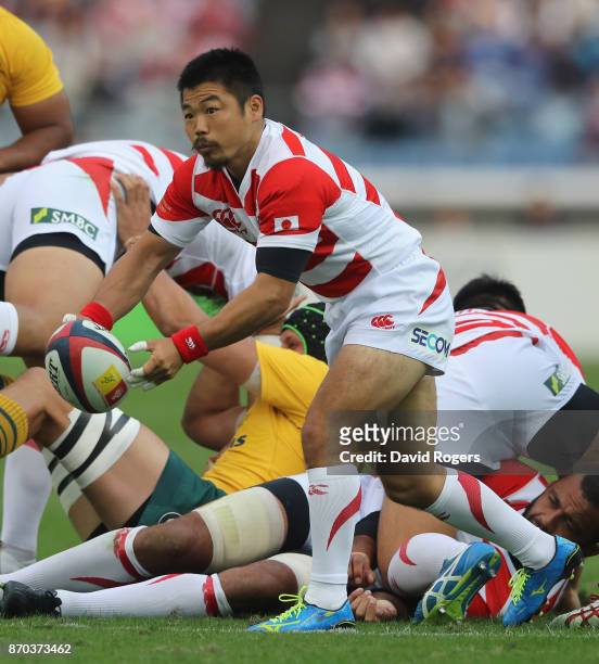 Fumiaki Tanaka of Japan passes the ball during the rugby union international match between Japan and Australia Wallabies at Nissan Stadium on...