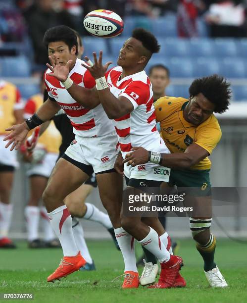 Kotaro Matsushima of Japan is tackled by Henry Speight during the rugby union international match between Japan and Australia Wallabies at Nissan...