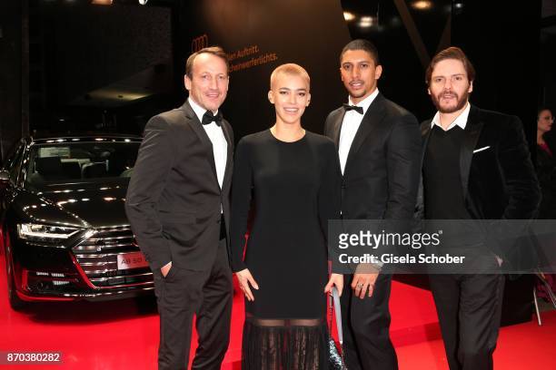 Wotan Wilke-Moehring, Alina Sueggeler, singer of the band 'Frida Gold', Andreas Bourani and Daniel Bruehl during the 24th Opera Gala benefit to...