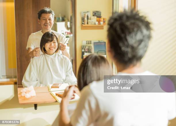 hair stylist's father and his daughter - t maz stock pictures, royalty-free photos & images