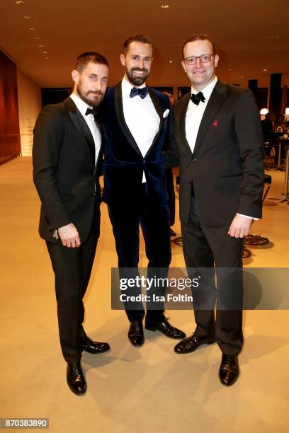 German actor Clemens Schick, Daniel Funke and his partner German politician Jens Spahn during the 24th Opera Gala at Deutsche Oper Berlin on November...