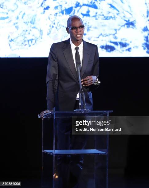 Honoree Mark Bradford, wearing Gucci, accepts an award onstage during the 2017 LACMA Art + Film Gala Honoring Mark Bradford and George Lucas...