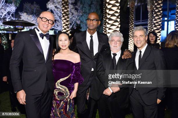 Gucci CEO Marco Bizzarri; co-host Eva Chow, wearing Gucci; honoree Mark Bradford, wearing Gucci; honoree George Lucas; and LACMA CEO and Wallis...