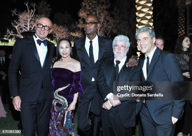 Gucci CEO Marco Bizzarri, 2017 Art+Film Gala Co-Chair Eva Chow, wearing Gucci, honoree Mark Bradford, wearing Gucci; honoree George Lucas, and LACMA...