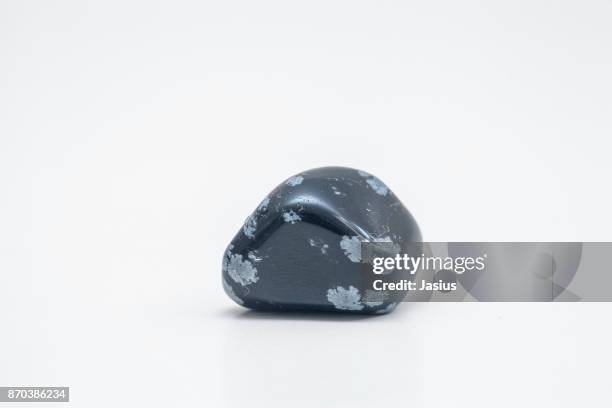 rock mineral macro photo with white background - obsidian stock pictures, royalty-free photos & images