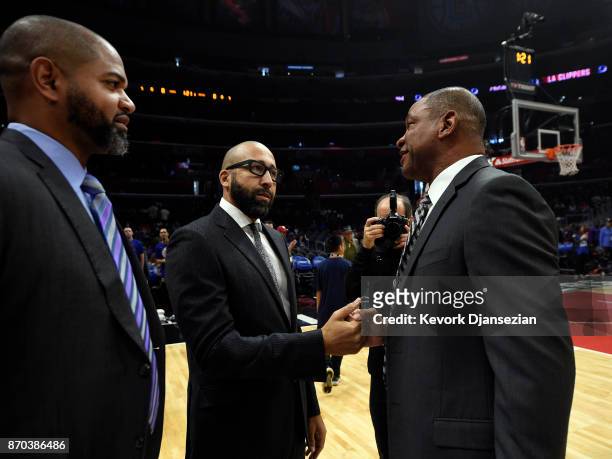 Head coach David Fizzle of the Memphis Grizzlies greets head coach Doc Rivers of the Los Angeles Clippers prior to the start of the basketball game...