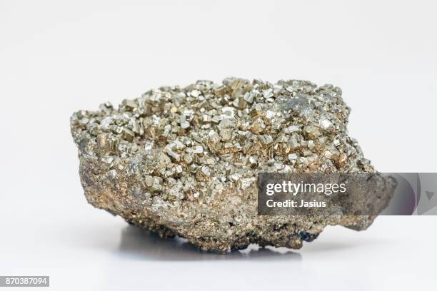 rock mineral macro photo with white background - pyrite stock pictures, royalty-free photos & images