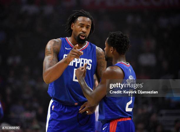 Patrick Beverley and DeAndre Jordan of the Los Angeles Clippers talk during first half of the basketball game against Memphis Grizzlies at Staples...