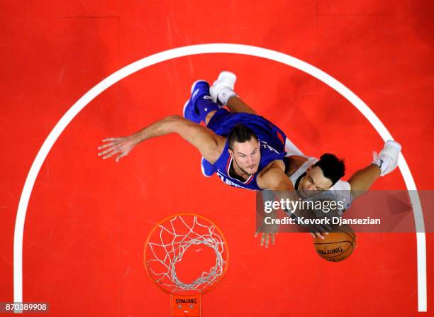 Danilo Gallinari of the Los Angeles Clippers blocks a layup by Dillon Brooks of the Memphis Grizzlies during the second half at Staples Center...