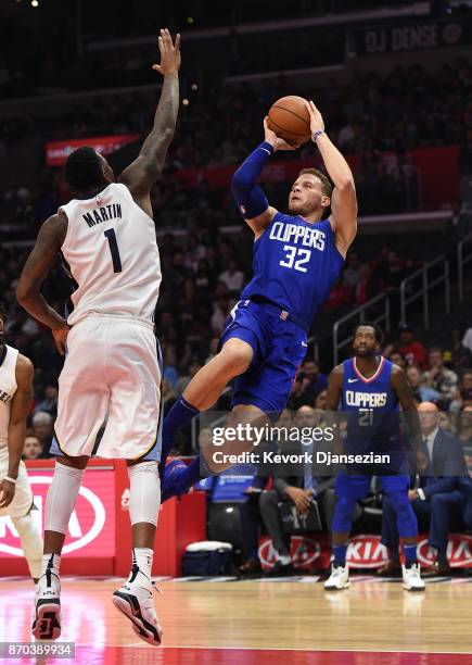 Blake Griffin of the Los Angeles Clippers shoots falling backwards against Jarell Martin of the Memphis Grizzlies during the second half of the...