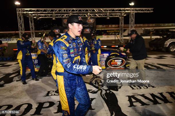 Todd Gilliland, driver of the NAPA Auto Parts Toyota, celebrates in victory lane after being named 2017 NASCAR K&N Pro Series West 2017 Champion...