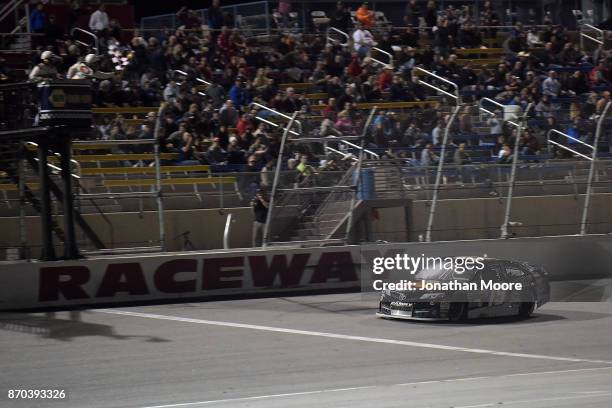 Derek Kraus, driver of the Carlyle Tools Toyota, takes the checkered flag during the NASCAR K&N Pro Series West Coast Stock Car Hall of Fame...