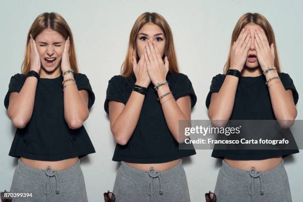 see no evil hear no evil ppeak no evil - hands covering mouth stock pictures, royalty-free photos & images