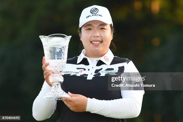 Shanshan Feng of China poses with the trophy after winning the TOTO Japan Classics 2017 at the Taiheiyo Club Minori Course on November 5, 2017 in...