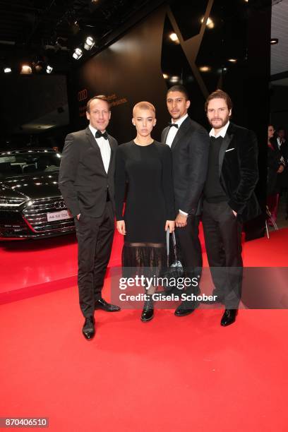 Wotan Wilke-Moehring, Alina Sueggeler, singer of the band 'Frida Gold', Andreas Bourani and Daniel Bruehl during the 24th Opera Gala benefit to...