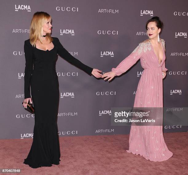 Melanie Griffith and Dakota Johnson attend the 2017 LACMA Art + Film gala at LACMA on November 4, 2017 in Los Angeles, California.