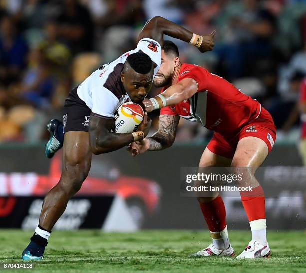 Akuila Uate of Fiji is tackled by Matty Fozard of Wales during the 2017 Rugby League World Cup match between Fiji and Wales at 1300SMILES Stadium on...