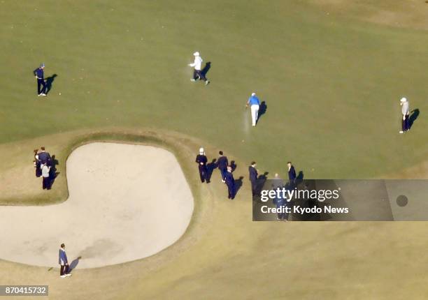 President Donald Trump and Japanese Prime Minister Shinzo Abe watch professional golfer Hideki Matsuyama at Kasumigaseki Country Club in Kawagoe,...