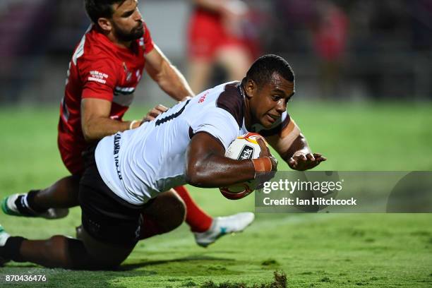 Petero Benjamin Nakubuwai of Fiji scores a try during the 2017 Rugby League World Cup match between Fiji and Wales at 1300SMILES Stadium on November...