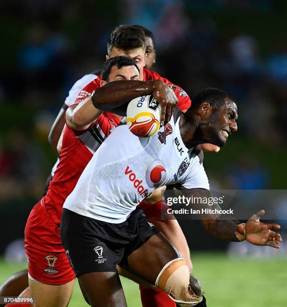 Suliasi Vunivalu of Fiji is tackled by Rhys Williams of Wales during the 2017 Rugby League World Cup match between Fiji and Wales at 1300SMILES...