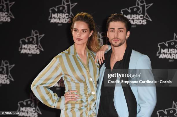 Singer Camille Lou and guest attend the 19th NRJ Music Awards on November 4, 2017 in Cannes, France.