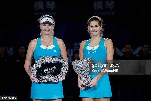 Winner Julia Goerges of Germany and runner-up Coco Vandeweghe of USA pose with their trophies following the Ladies singles final on day 6 WTA Elite...