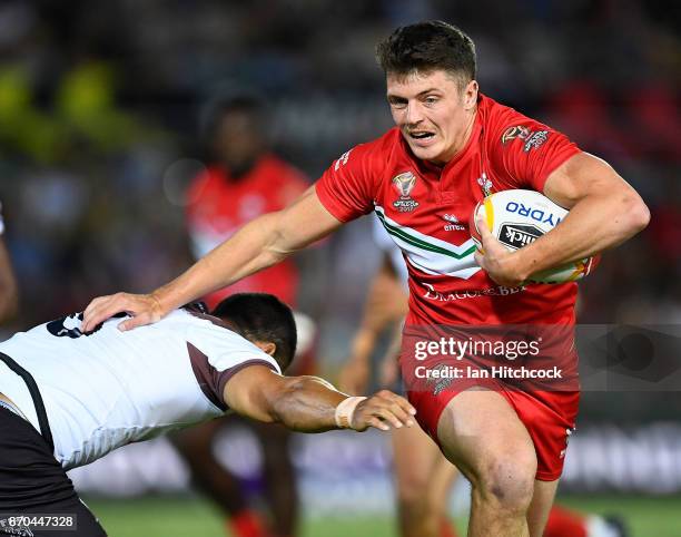 Rhodri Lloyd of Wales skips out of a tackle of Jarryd Hayne of Fiji during the 2017 Rugby League World Cup match between Fiji and Wales at 1300SMILES...