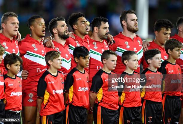 The Welsh team stand together for the national anthem before the start of the 2017 Rugby League World Cup match between Fiji and Wales at 1300SMILES...