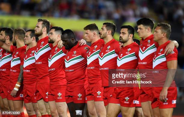 The Welsh team stand together for singing of the Fijian hymn before the start of the 2017 Rugby League World Cup match between Fiji and Wales at...