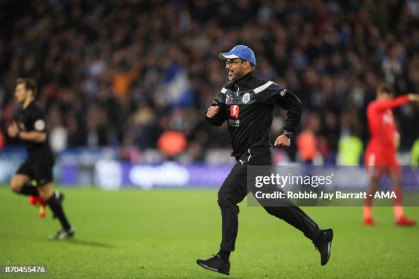 David Wagner head coach / manager of Huddersfield Town celebrates as he runs on to the pitch at full time during the Premier League match between...