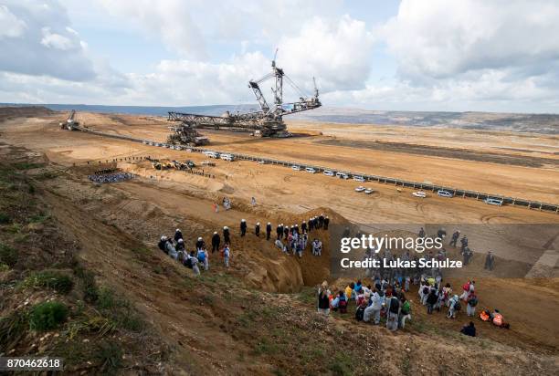 Police blocks environmental protesters at the open-cast brown coal mining Hambach on November 5, 2017 near Kerpen, Germany. The protest, part of a...