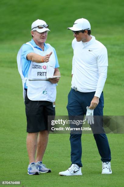 Dylan Frittelli of South Africa looks on with caddie John Curtis during the final round of the Turkish Airlines Open at the Regnum Carya Golf & Spa...