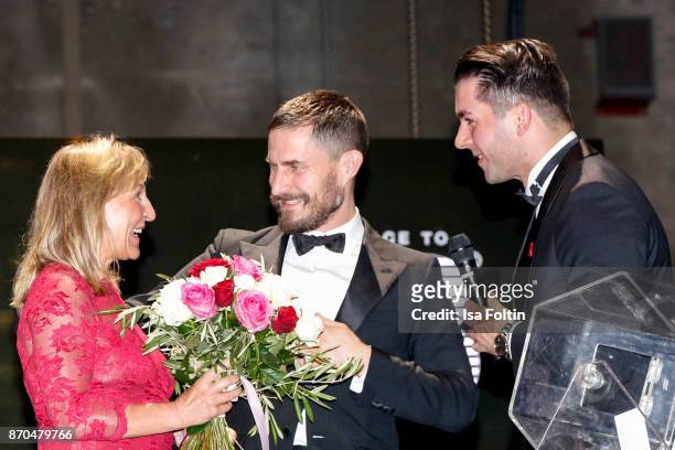 German actor Clemens Schick, an employee of Audi and the winner of the car during the aftershow party during during the 24th Opera Gala at Deutsche...