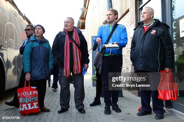 Fans wait for the players to arrive for the The Emirates FA Cup first round match between Dartford and Swindon Town at the Princes Park Stadium on...