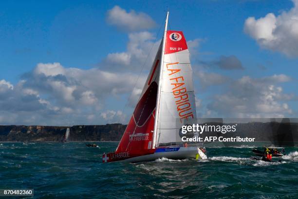 Skippers of the "La Fabrique" monohull Imoca Frederic Denis and Alan Roura sail as they take the start of the Transat Jacques Vabre duo sailing race...