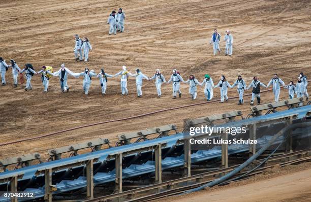 Environmental protesters enter the open-cast brown coal mining Hambach on November 5, 2017 near Kerpen, Germany. The protest, part of a string of...